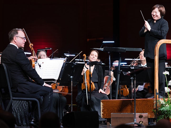 Xian Zhang and the New Jersey Symphony receiving applause after a performance at NJPAC